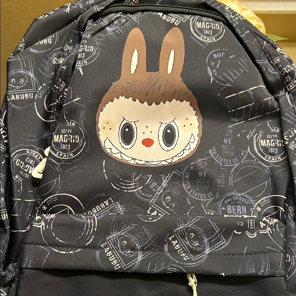 Black Backpack decorated w/ stamps & Toffee Labubu! Great for school or vacation